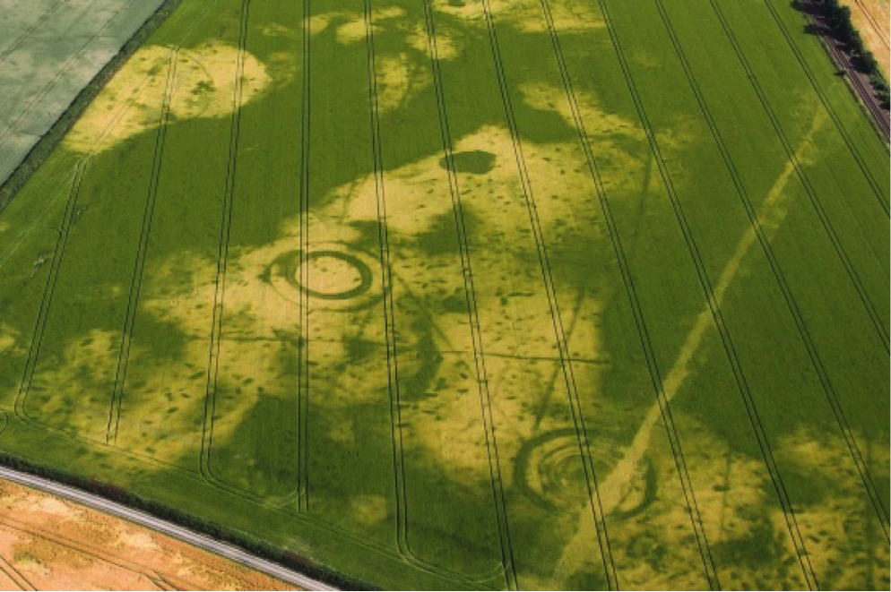 A triple-ditched bronze age burial mound and prehistoric pit alignment in Scropton, Derbyshire